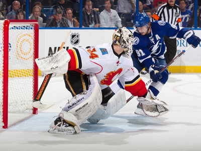 Stamkos strikes in overtime, Flames rally falls just short
