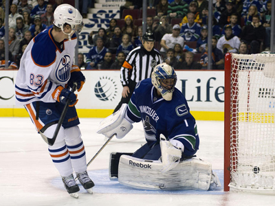 Hemsky helps Oilers slide past Canucks in season opener