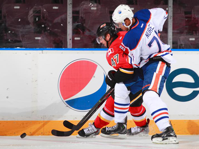 Flames thump Oilers in rookie tournament opener